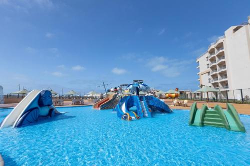 a water slide in a swimming pool at Gewan Resort New Alamein in El Alamein