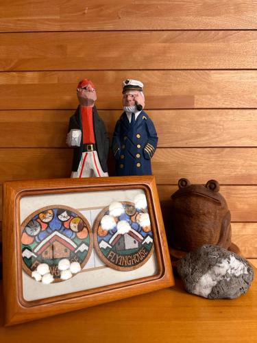 a couple of figurines sitting next to a box of rocks at FLYING HOUSE in Chikuni