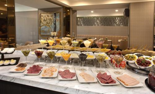 a buffet with many different types of food on a table at Mula Hotel in Istanbul