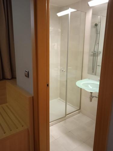 a bathroom with a shower and a sink at U Hotel Villa-Gomá in Zaragoza