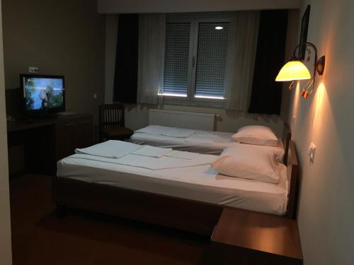 Voodi või voodid majutusasutuse Hotel Oaza toas