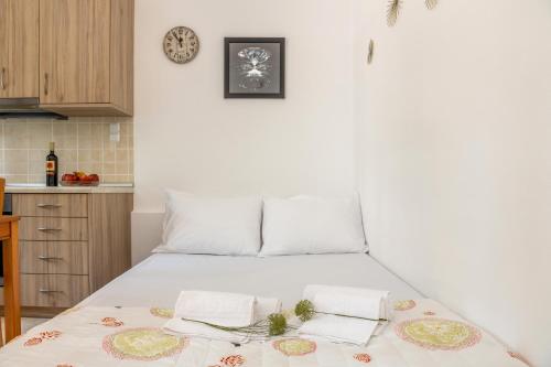 Ένα ή περισσότερα κρεβάτια σε δωμάτιο στο The Platano_Village Residence