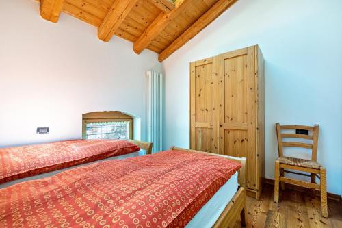 Postel nebo postele na pokoji v ubytování Agritur Piazera Attico