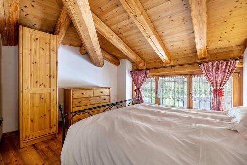 Postel nebo postele na pokoji v ubytování Agritur Piazera Attico