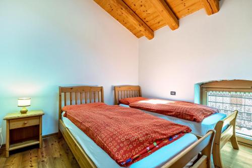 Postel nebo postele na pokoji v ubytování Agritur Piazera Attico
