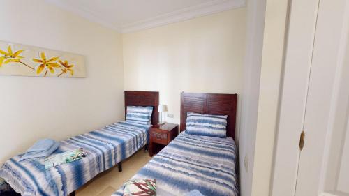 En eller flere senge i et værelse på Darsena RodaGolf-A Murcia Holiday Rentals Property