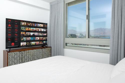 Ένα ή περισσότερα κρεβάτια σε δωμάτιο στο Sea Side-Presidential Suite& Privet Jacuzzi Eilat