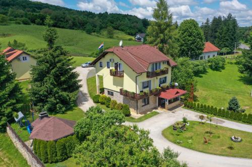 an aerial view of a house with a driveway at House Palijan in Rakovica