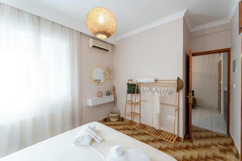 a bedroom with a bed and a mirror at La Calma in Argostoli