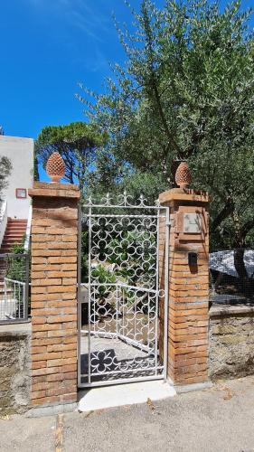 a gate with a fence and a gate with at Villa Matisse - Damecuta Park in Anacapri
