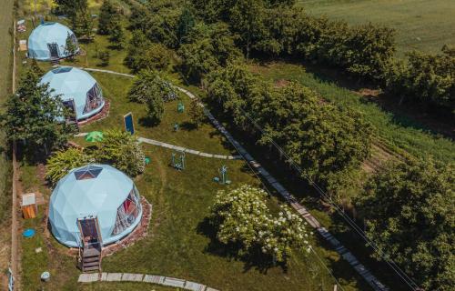 an overhead view of a park with tents and trees at Glamping Stacja Zieleniec w Nałęczowie in Nałęczów