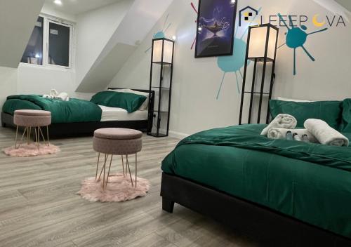 a bedroom with two beds with green sheets and pink accents at Luxury & Modern 1 BR Apartment 5Plus Guests Couples Families Business SleeepOva Short Lets & Serviced Accommodation in London