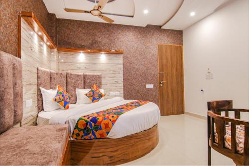 a bedroom with a large bed in a room at FabHotel Meridian Inn in Mohali