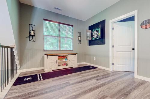 a living room with a window and a rug at Blue Ridge Delight in Clayton