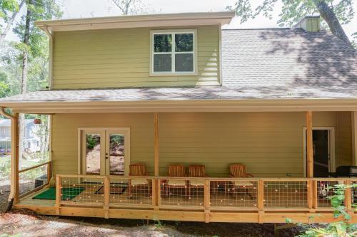 a screened porch on a house with chairs on it at Blue Ridge Delight in Clayton