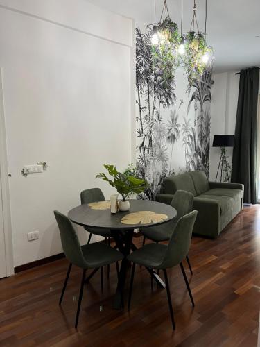 a living room with a table and a couch at Tropical house in Lecce