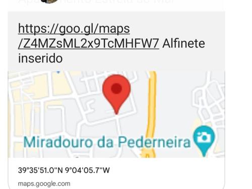 a screenshot of a cell phone with a map and a pin at Apartamento Estrela do Mar in Nazaré