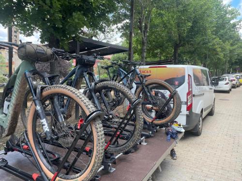a group of bikes parked next to a van at Hotel Can Pamplona in Vic