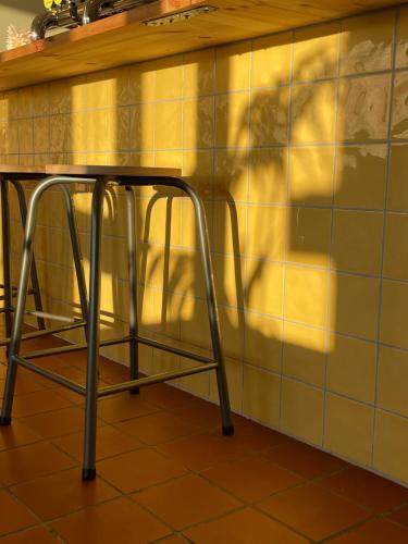 a table with a chair in a kitchen at Balestrand Hotel in Balestrand