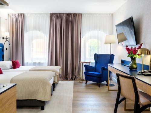 Postel nebo postele na pokoji v ubytování Hotel Golden Queen