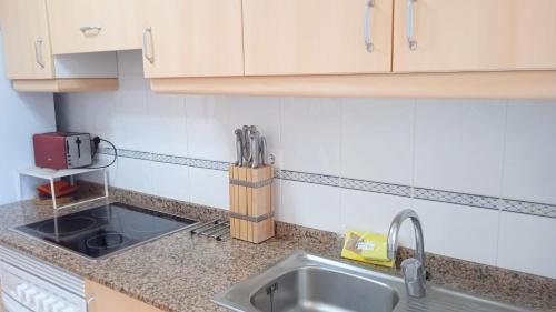 Kuchyň nebo kuchyňský kout v ubytování Apartamentos Capricho 3000