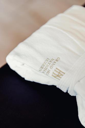 a white pillow with the words happy birthday written on it at Grand Hotel National Luzern in Luzern