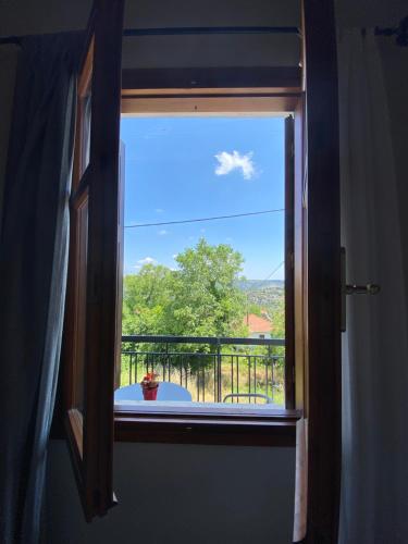 a window with a view of a balcony at 1924 Studios 1 in Áyios Pétros