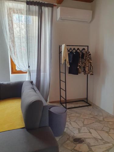 a living room with a couch and a window at OLD HOUSE in Jajce