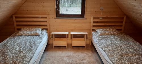 Postel nebo postele na pokoji v ubytování Domek na Mazurach w zagajniku przy jeziorze
