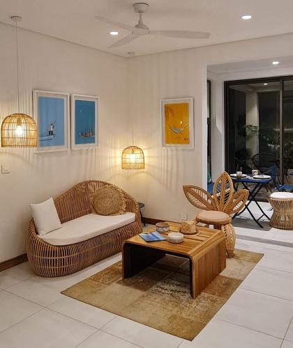 a living room with a couch and a table at Blue Ocean Suites & Apartments in Trou dʼ Eau Douce