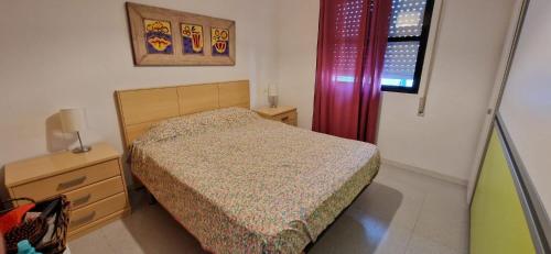Ένα ή περισσότερα κρεβάτια σε δωμάτιο στο PISO EN APARTACLUB LA BARROSA