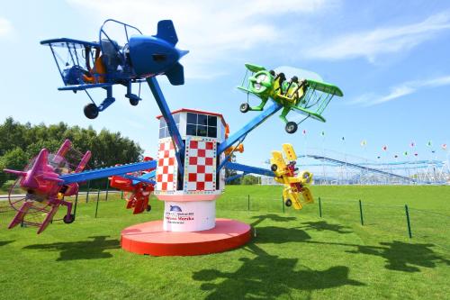 a group of different types of planes on a field at Aquapark Health Resort & Medical SPA Panorama Morska All Inclusive in Jarosławiec
