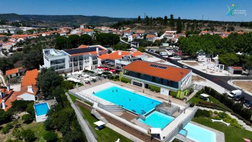 an aerial view of a building with a swimming pool at Rupestre Arts Hotel Ródão in Vila Velha de Ródão