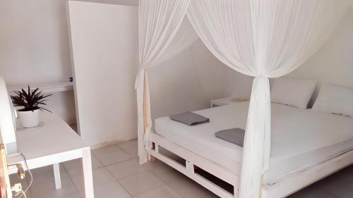 Letto o letti in una camera di the village rua beach homestay
