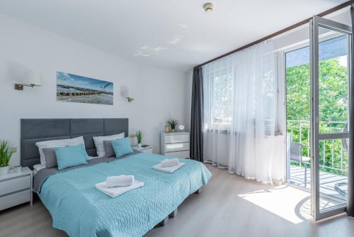Posteľ alebo postele v izbe v ubytovaní Apartament z balkonem Lazur 250m od morza