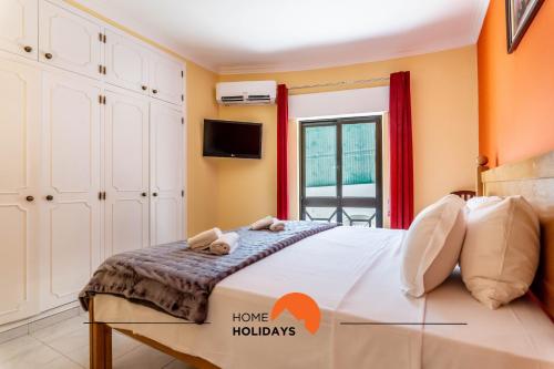 Ένα ή περισσότερα κρεβάτια σε δωμάτιο στο #180 T2 Ondas do Mar by Home Holidays