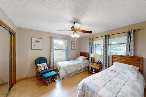 En eller flere senge i et værelse på Citrus Cottage