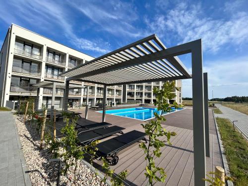 Bazén v ubytování Jaukūs apartamentai prie jūros nebo v jeho okolí