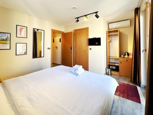 Postel nebo postele na pokoji v ubytování Sultan Pier Hotel