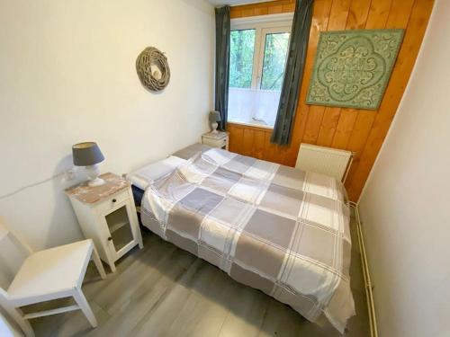 Postel nebo postele na pokoji v ubytování Nunspeet Vakantiehuisje