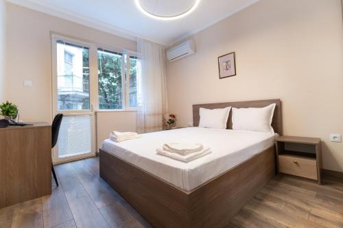 מיטה או מיטות בחדר ב-City center 2-Bedroom Apartment