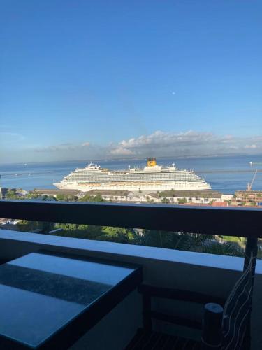 a cruise ship in the water with a balcony at Aram Yamí Boutique Hotel in Salvador