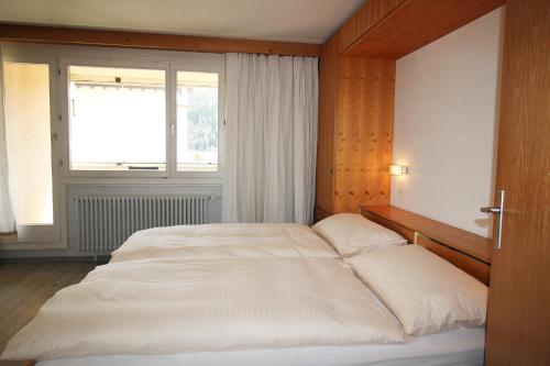 Postel nebo postele na pokoji v ubytování Residenza Lagrev 2 Zimmerwohnung Nr 117 - Typ 20A - 1 Etage - Süd