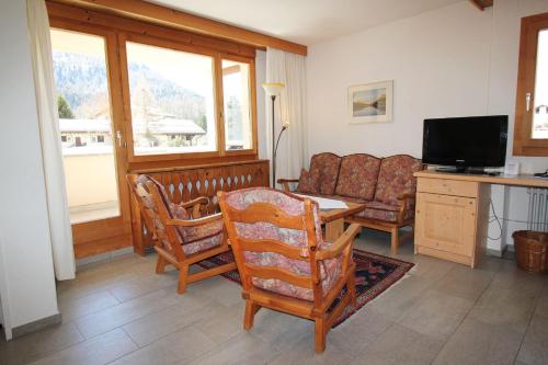 TV a/nebo společenská místnost v ubytování Residenza Lagrev 2 Zimmerwohnung Nr 012 - Typ 21A - Hochparterre - Süd