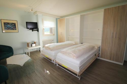 Ένα ή περισσότερα κρεβάτια σε δωμάτιο στο Residenza Lagrev 2 Zimmerwohnung Nr 122 - Typ 21A - 1 Etage - Süd