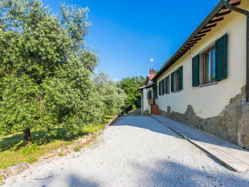 a road next to a house with a tree at Holiday Home Lavanda by Interhome in Badia Agnano