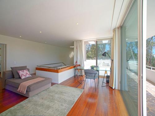 a living room with a couch and a table at Holiday Home Villa Golf by Interhome in Portimão