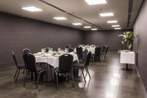 a conference room with tables and chairs in it at Zenit Vigo in Vigo