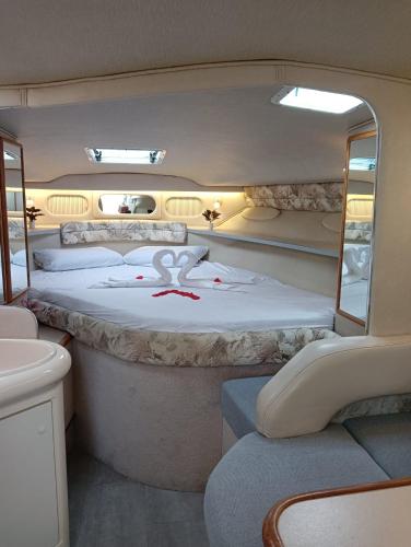 una cama grande en la parte trasera de una furgoneta en Diagonal Mar Sailboat, en Barcelona