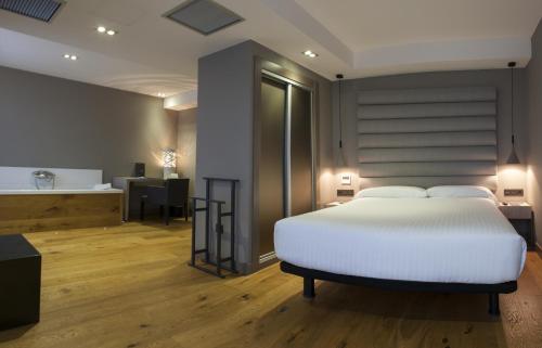 Кровать или кровати в номере Zenit Vigo